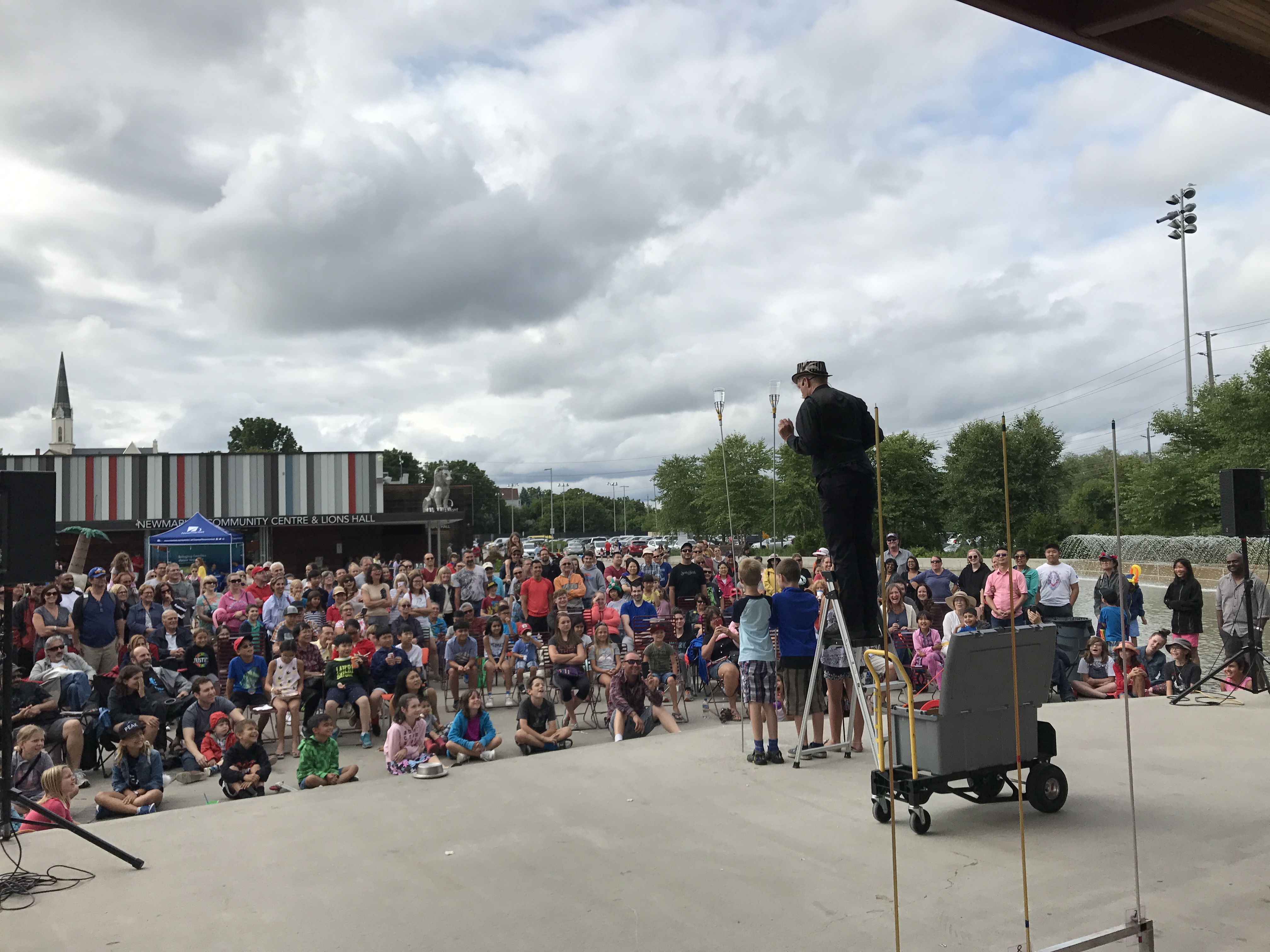 rockabilly joe inviting Children up on stage as assistants in magic show